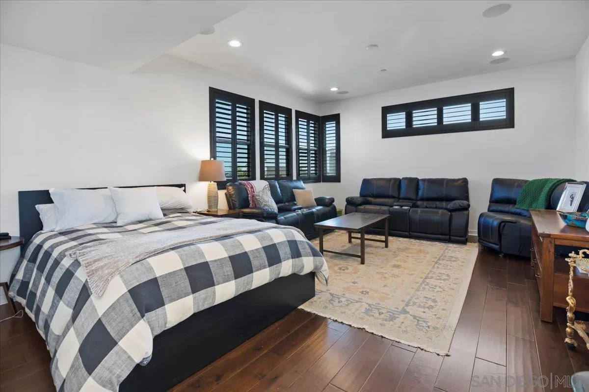 2123 Element Way Chula Vista, CA 91915 - Photo 37 of 42 a bedroom with a bed a couch and a large window