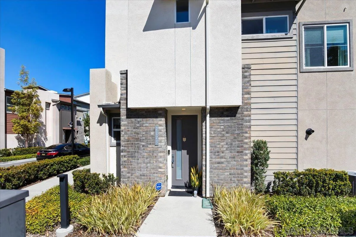 2123 Element Way Chula Vista, CA 91915 - Photo 4 of 42 a front view of a house with brick walls