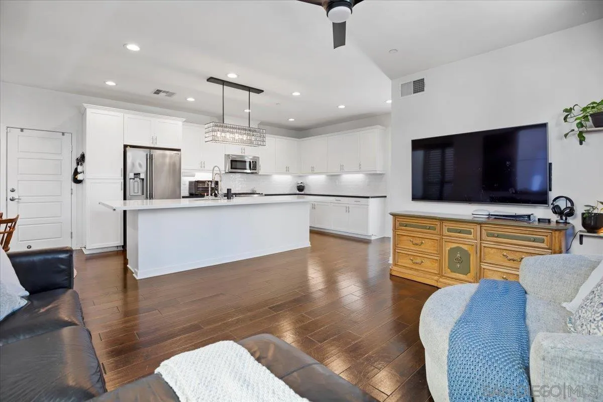 2123 Element Way Chula Vista, CA 91915 - Photo 6 of 42 a living room with stainless steel appliances furniture and a flat screen tv