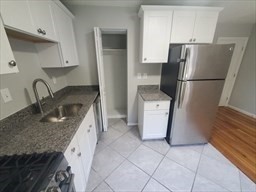 174 Pine Street, Unit 33 Holbrook, MA 02343 - Photo 2 of 23 a kitchen with a refrigerator sink and stove
