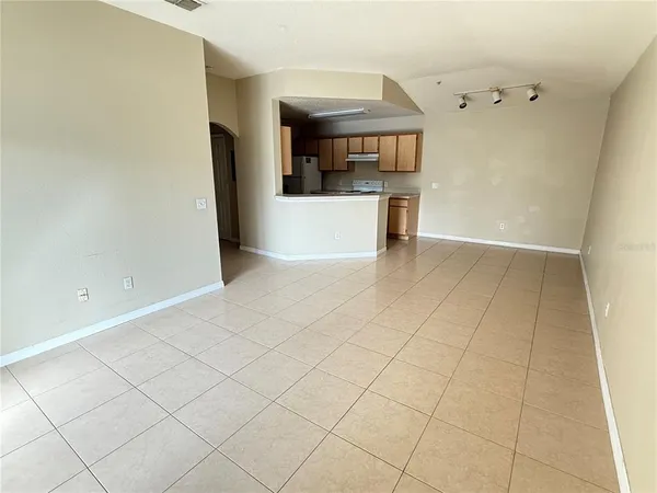 a view of a kitchen with furniture and a window