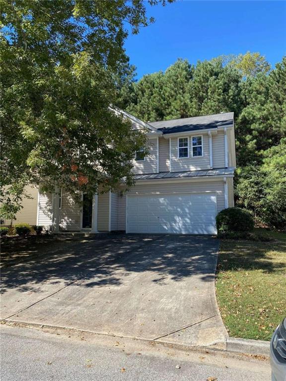 5741 Sable Way Atlanta, GA 30349 - Photo 1 of 1 a view of a house with a yard