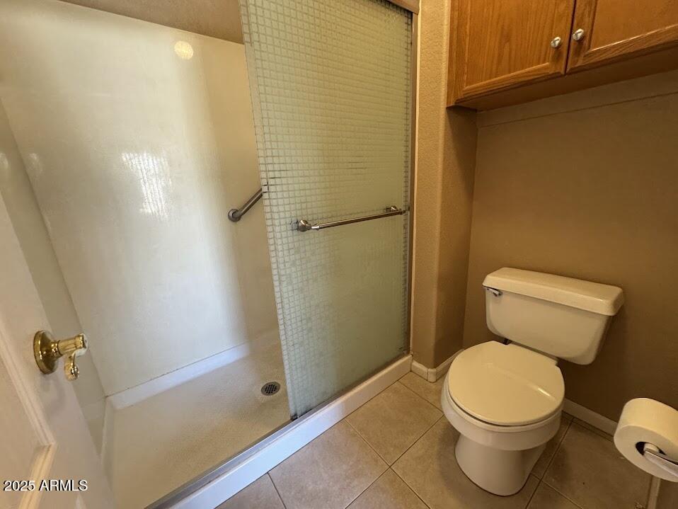3124 East Piute Avenue Phoenix, AZ 85050 - Photo 22 of 25 a white toilet sitting next to a shower