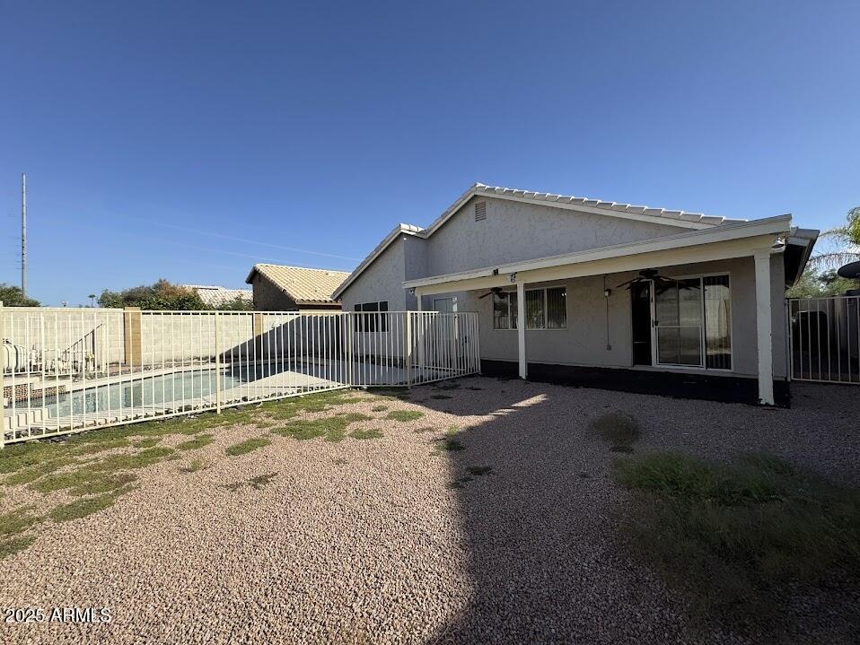 3124 East Piute Avenue Phoenix, AZ 85050 - Photo 23 of 25 a front view of a house with a garden