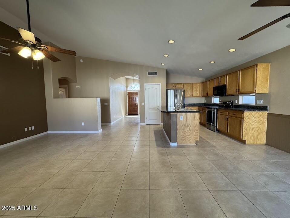 3124 East Piute Avenue Phoenix, AZ 85050 - Photo 8 of 25 a view of a kitchen with kitchen island a counter top space a sink stainless steel appliances and cabinets