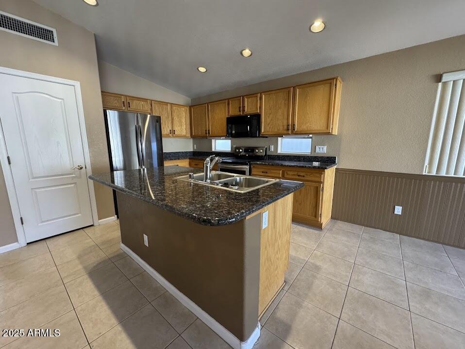 3124 East Piute Avenue Phoenix, AZ 85050 - Photo 10 of 25 a kitchen with stainless steel appliances granite countertop a stove a refrigerator and a sink