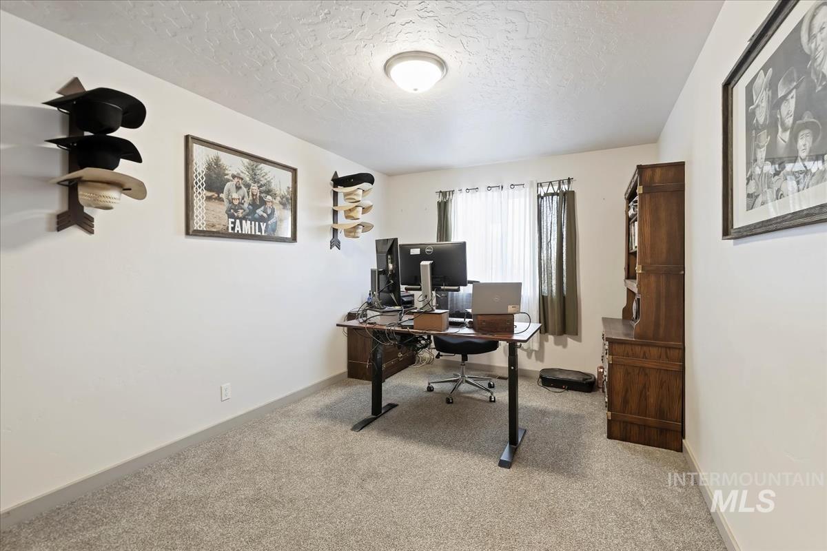17571 Goodson Road Caldwell, ID 83607 - Photo 16 of 36 Office space featuring light carpet and a textured ceiling