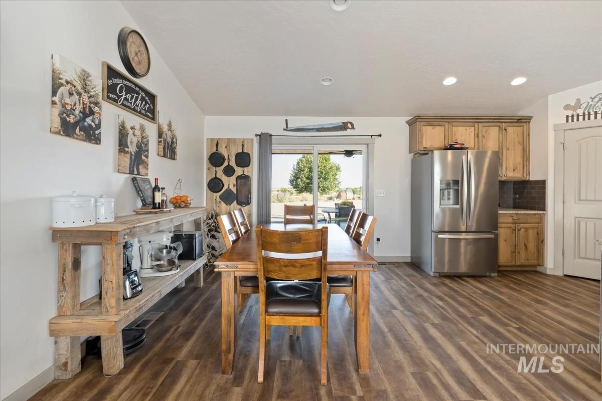 17571 Goodson Road Caldwell, ID 83607 - Photo 7 of 36 Dining space with dark wood-style floors and recessed lighting