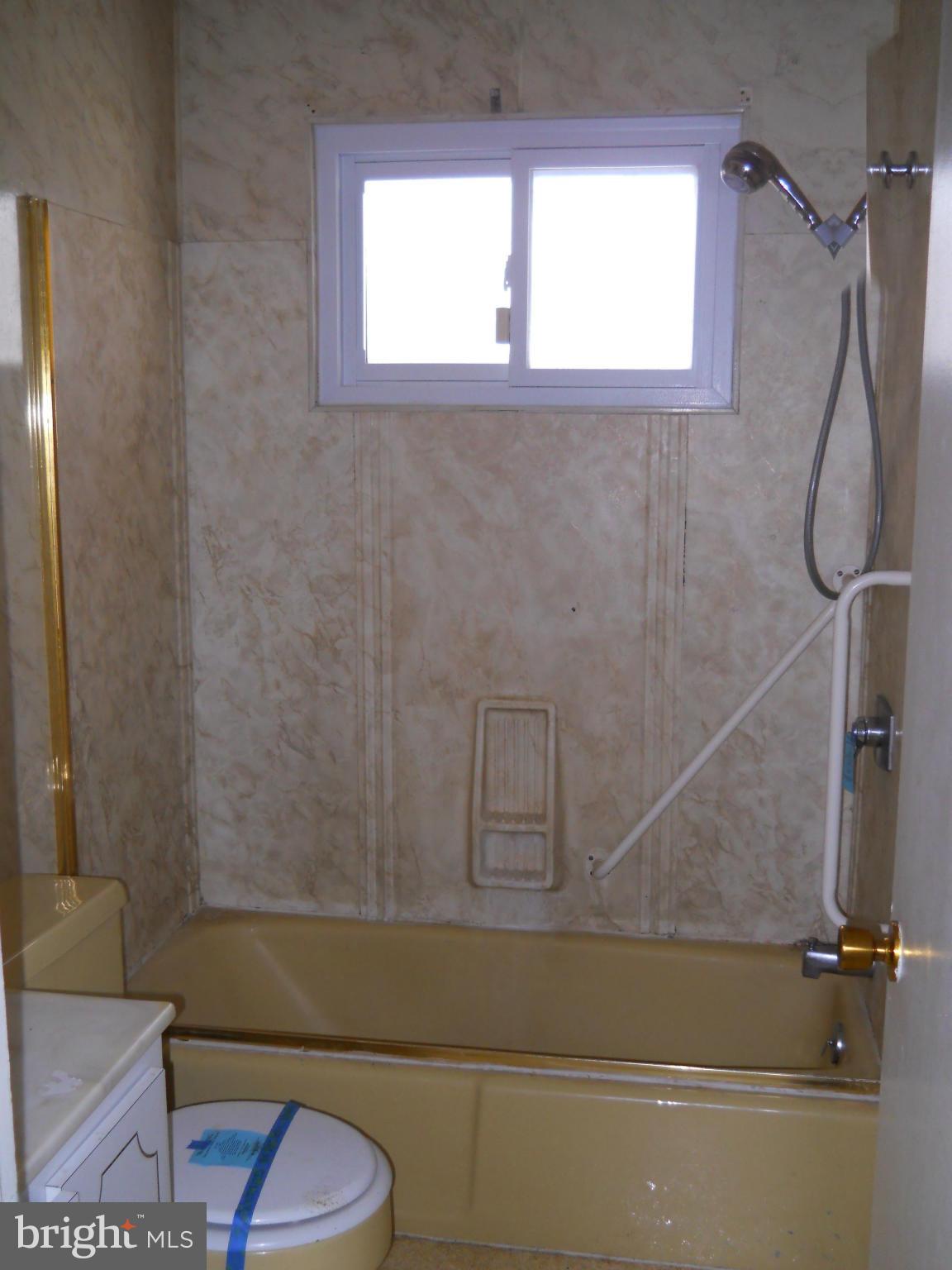 7506 Rockridge Road Baltimore, MD 21208 - Photo 11 of 12 a bathroom with a shower