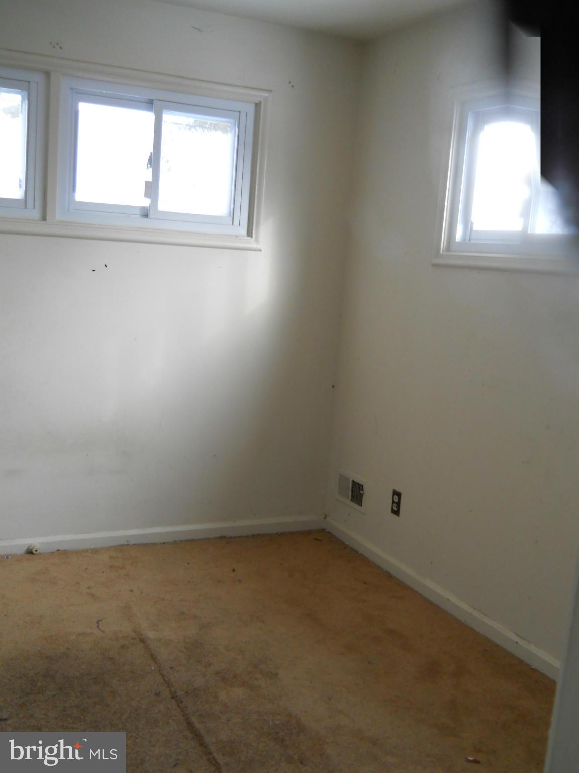 7506 Rockridge Road Baltimore, MD 21208 - Photo 8 of 12 an empty room with a window