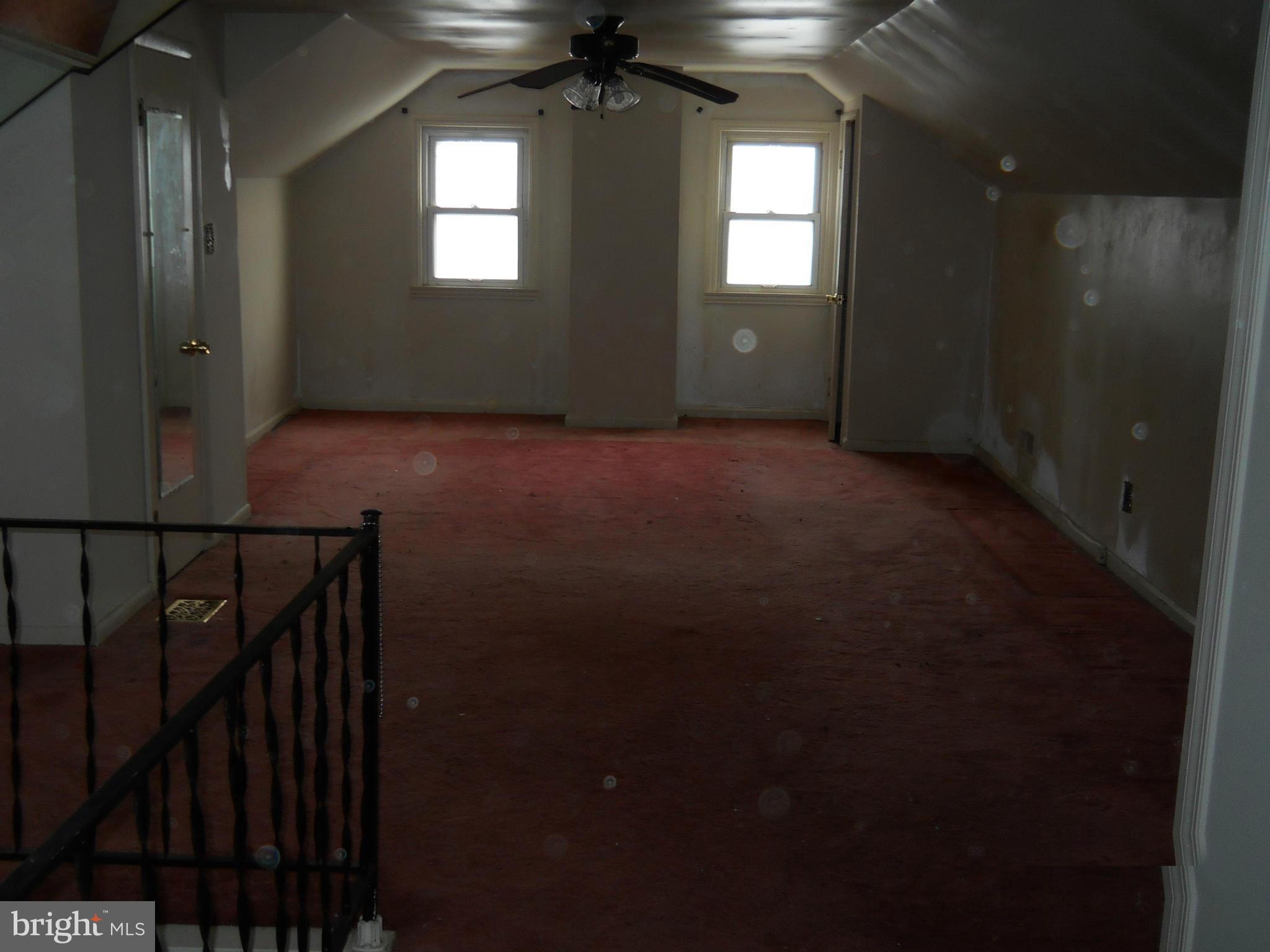 7506 Rockridge Road Baltimore, MD 21208 - Photo 9 of 12 a view of empty room with stairs