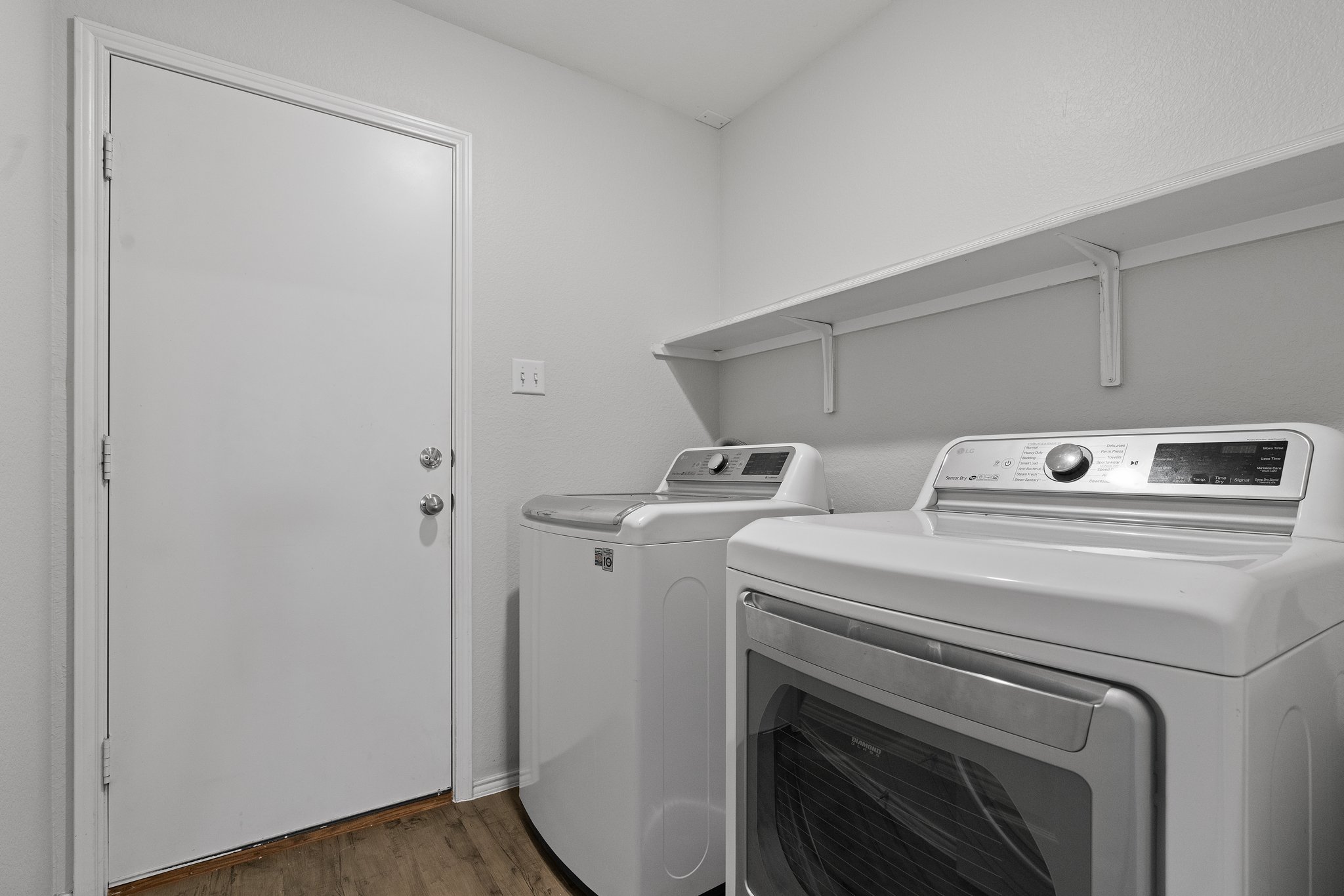 5800 Maciver Drive Austin, TX 78754 - Photo 21 of 27 Washroom with dark wood-style flooring and washing machine and clothes dryer