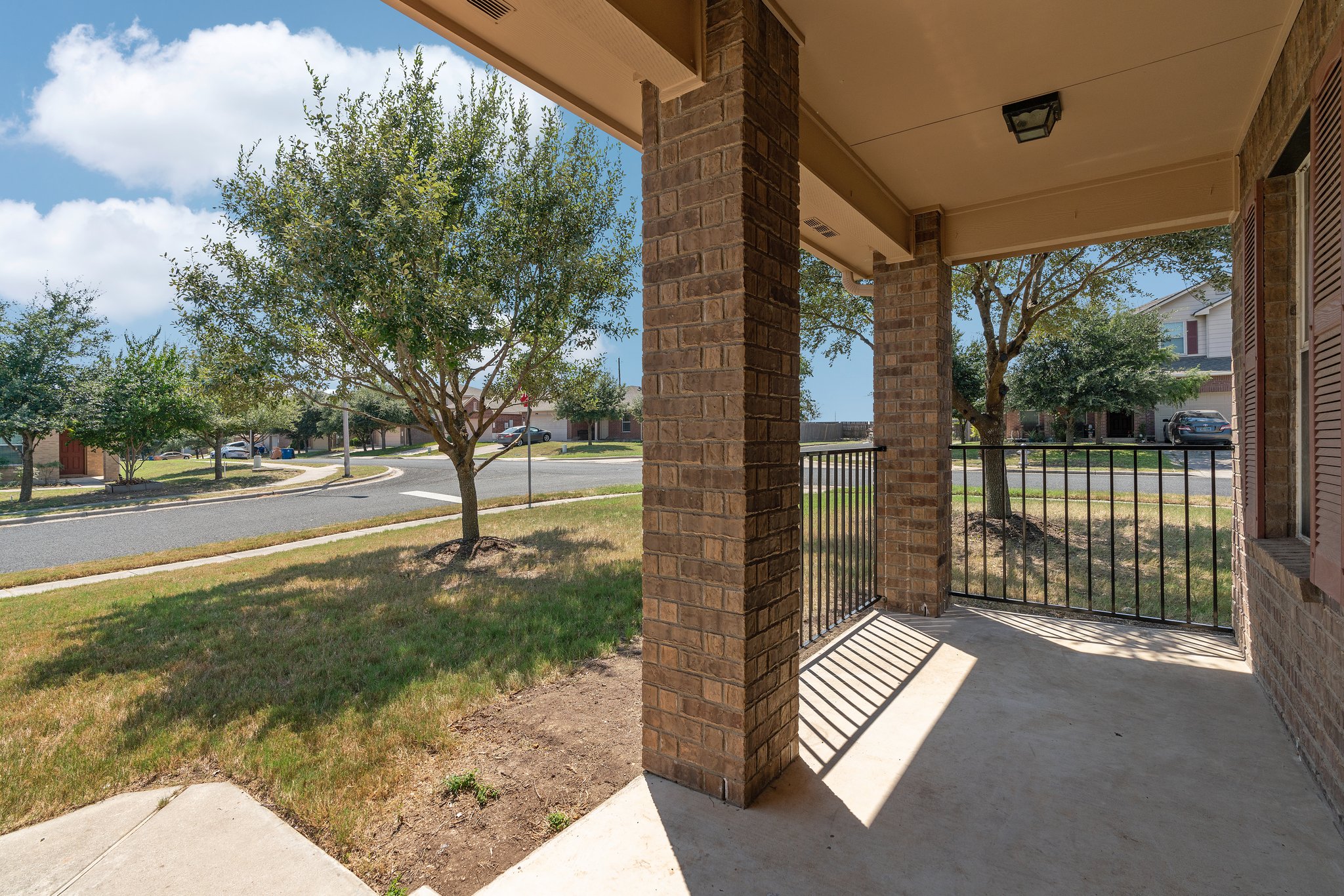 5800 Maciver Drive Austin, TX 78754 - Photo 26 of 27 Covered porch featuring a lawn