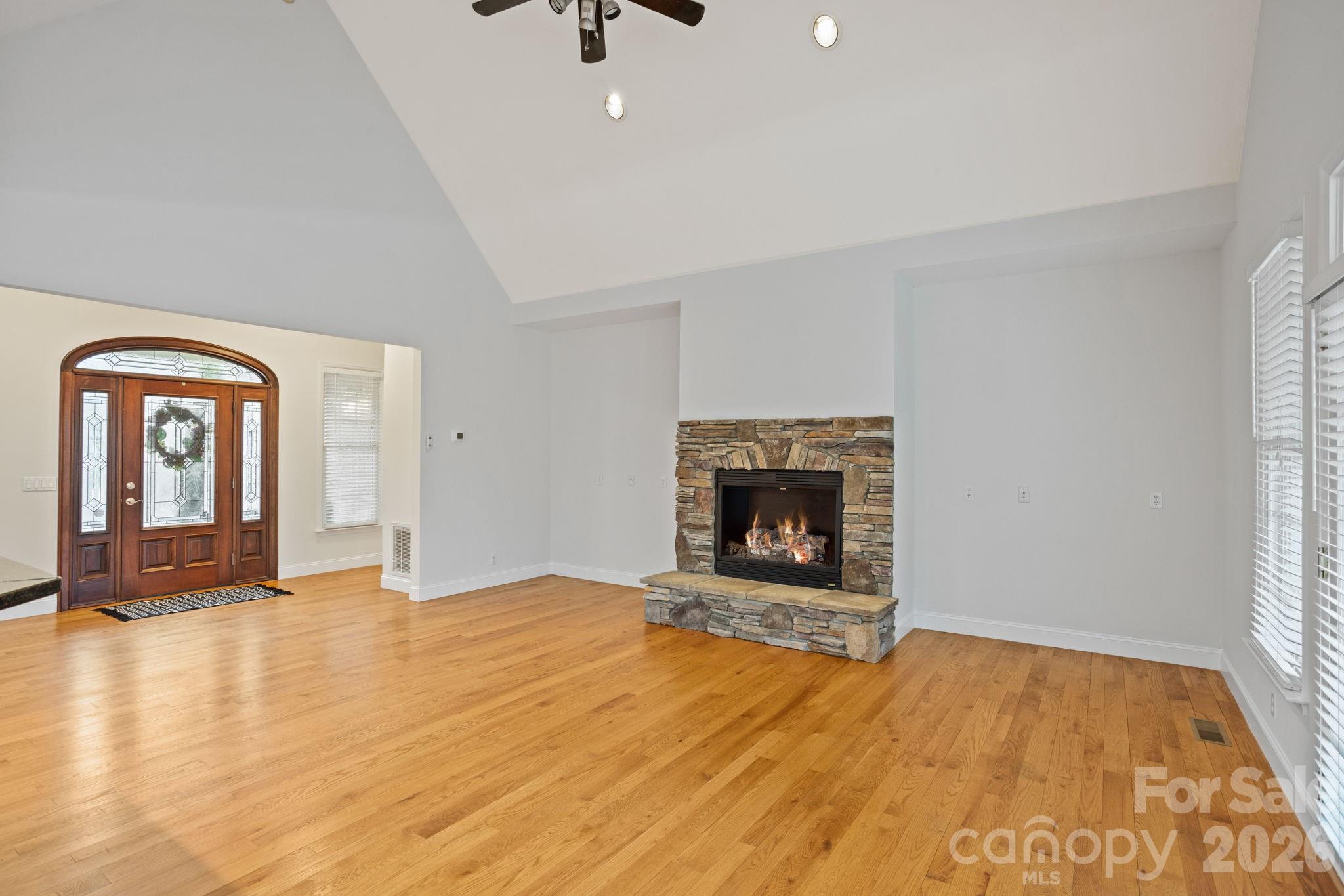 199 Judson Ridge Road Arden, NC 28704 - Photo 12 of 48 a view of an empty room with window and fire place