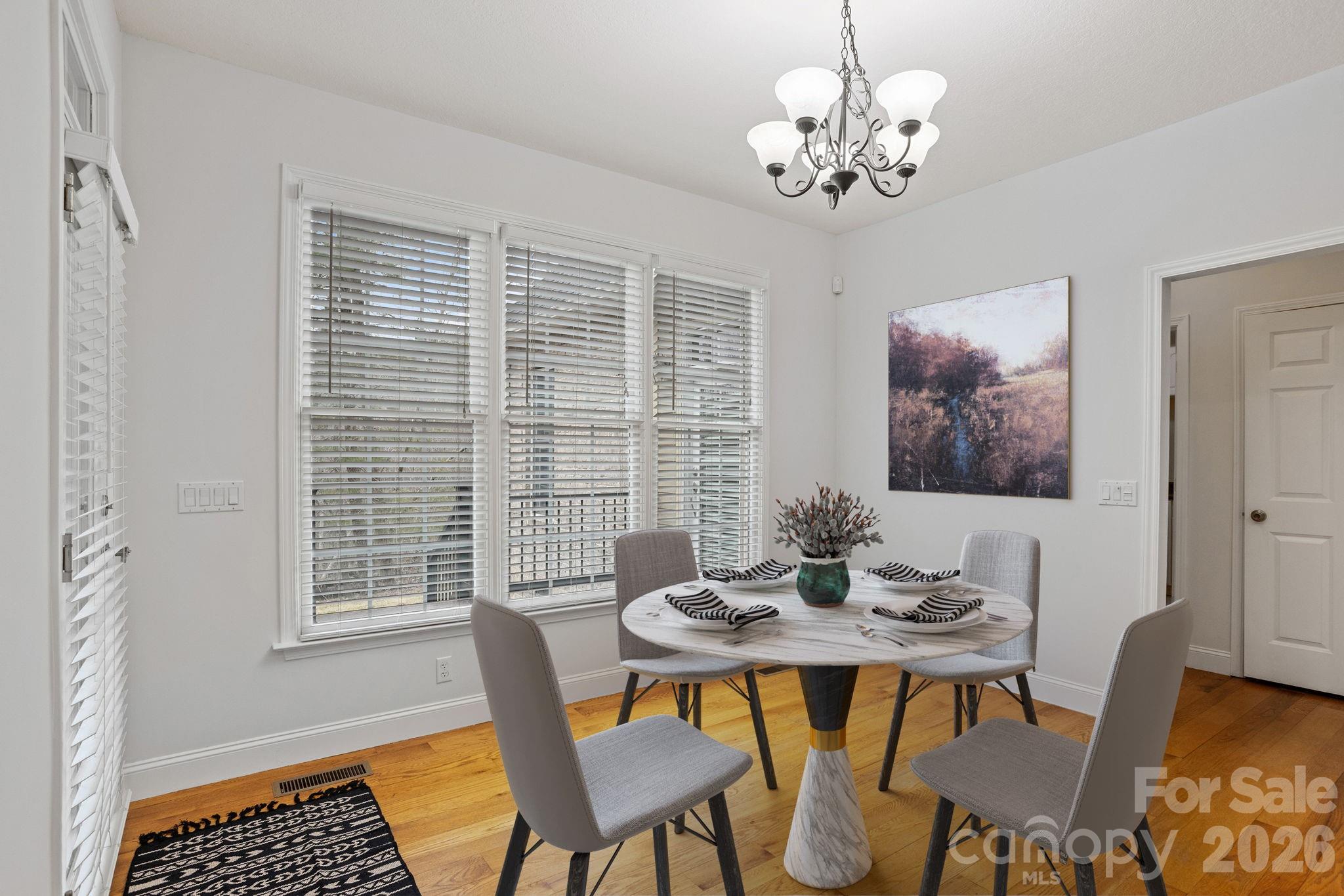 199 Judson Ridge Road Arden, NC 28704 - Photo 15 of 48 a view of a dining room with furniture window and wooden floor