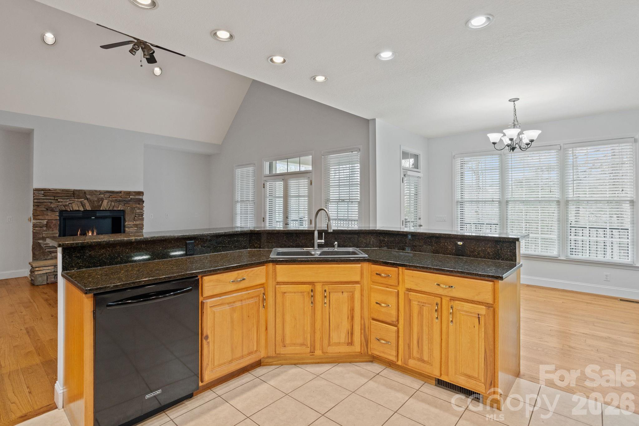 199 Judson Ridge Road Arden, NC 28704 - Photo 19 of 48 a large kitchen with granite countertop a sink and cabinets