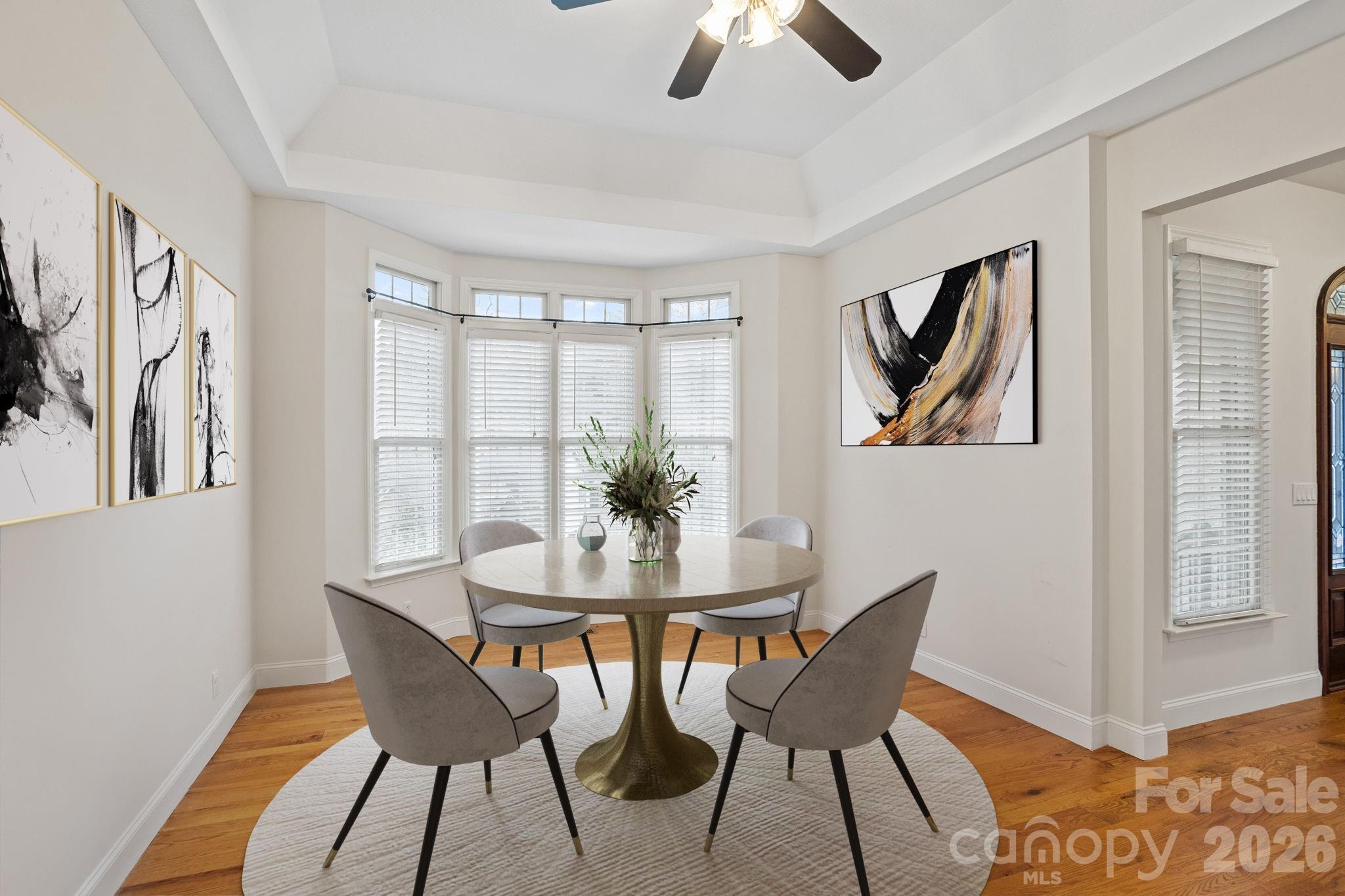 199 Judson Ridge Road Arden, NC 28704 - Photo 21 of 48 a view of a dining room with furniture window and wooden floor