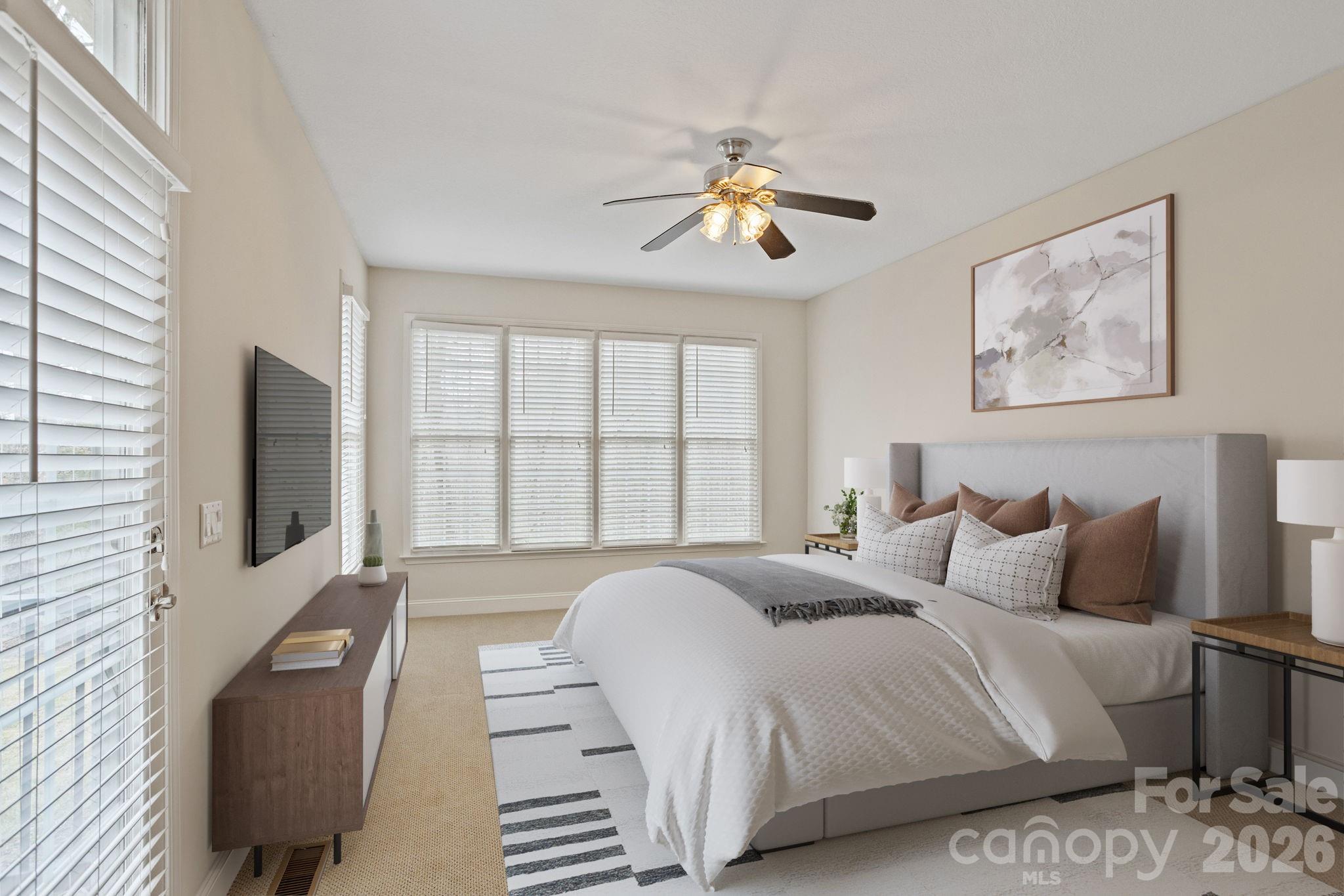 199 Judson Ridge Road Arden, NC 28704 - Photo 24 of 48 a bedroom with a large bed and a flat screen tv