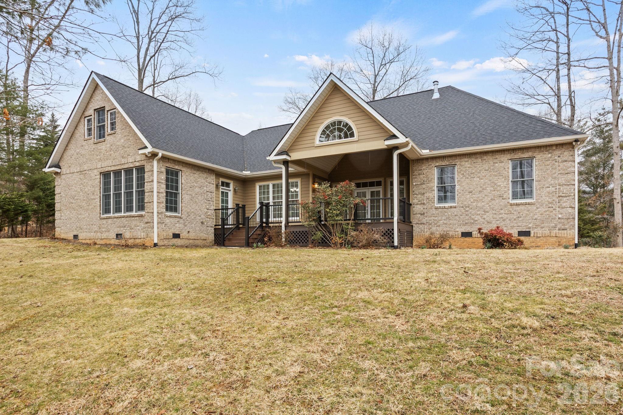 199 Judson Ridge Road Arden, NC 28704 - Photo 43 of 48 a front view of a house with a yard and garage