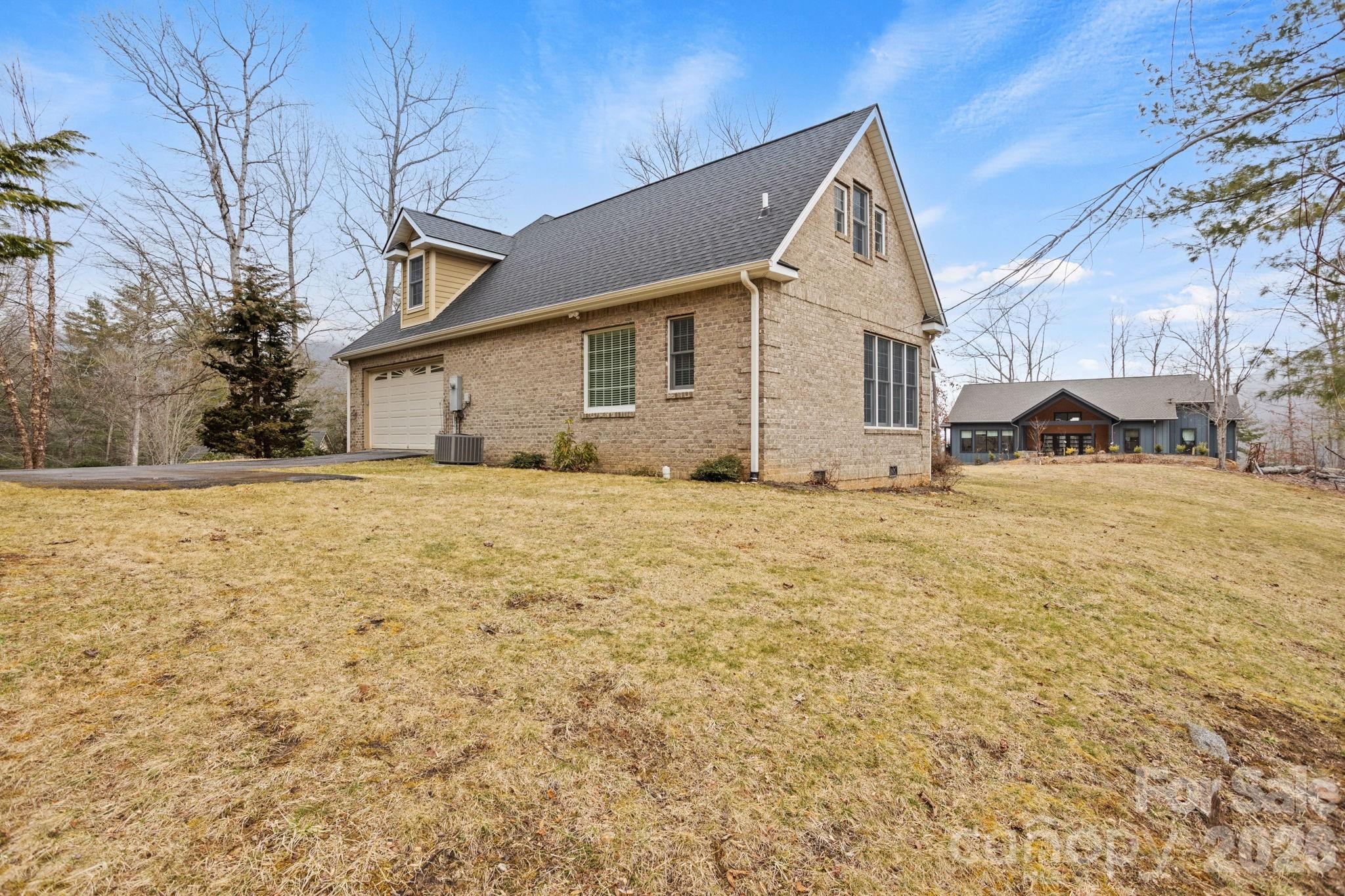 199 Judson Ridge Road Arden, NC 28704 - Photo 44 of 48 a view of a house with snow on the side of the road