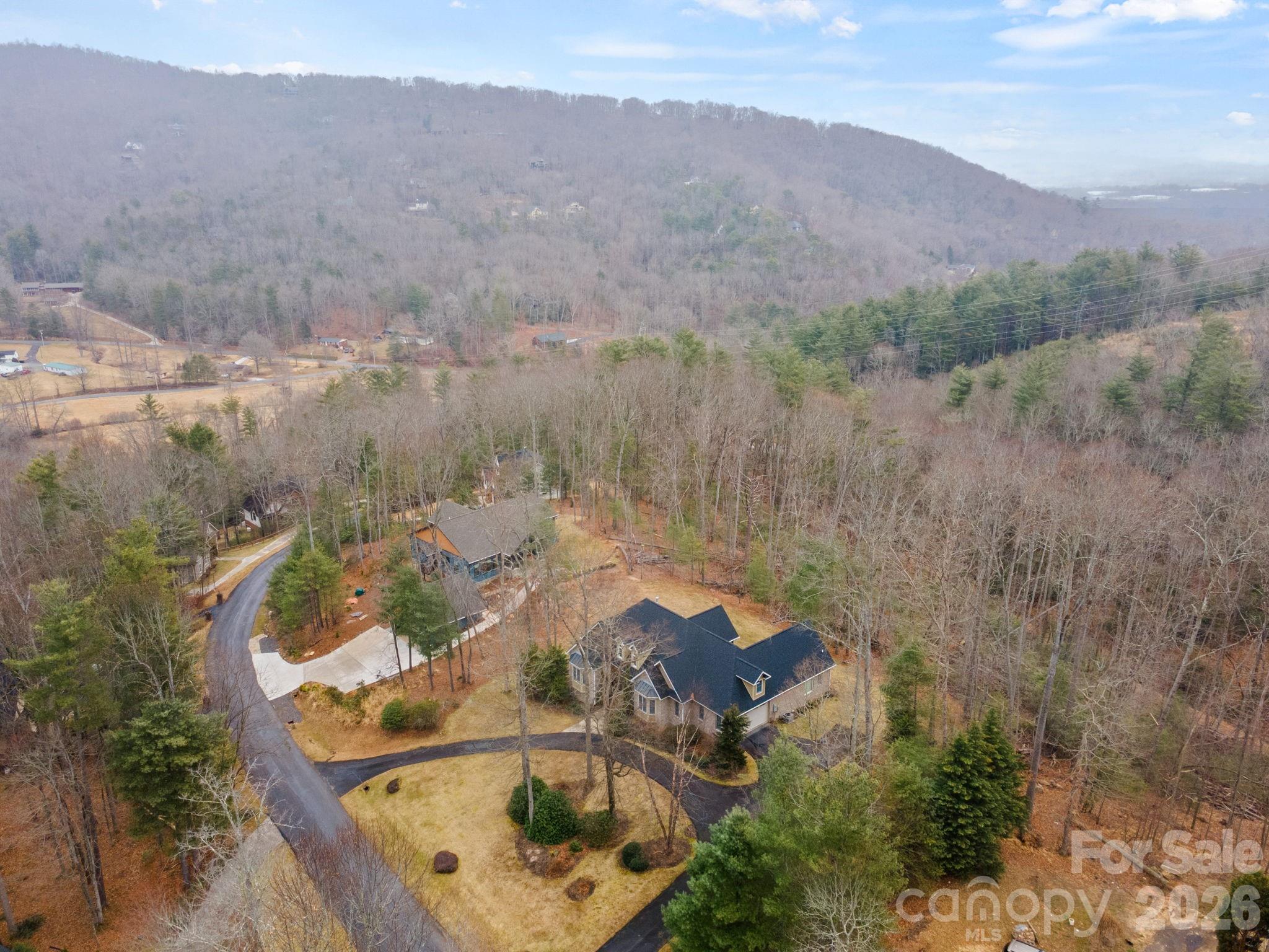 199 Judson Ridge Road Arden, NC 28704 - Photo 47 of 48 an aerial view of a house with mountain view