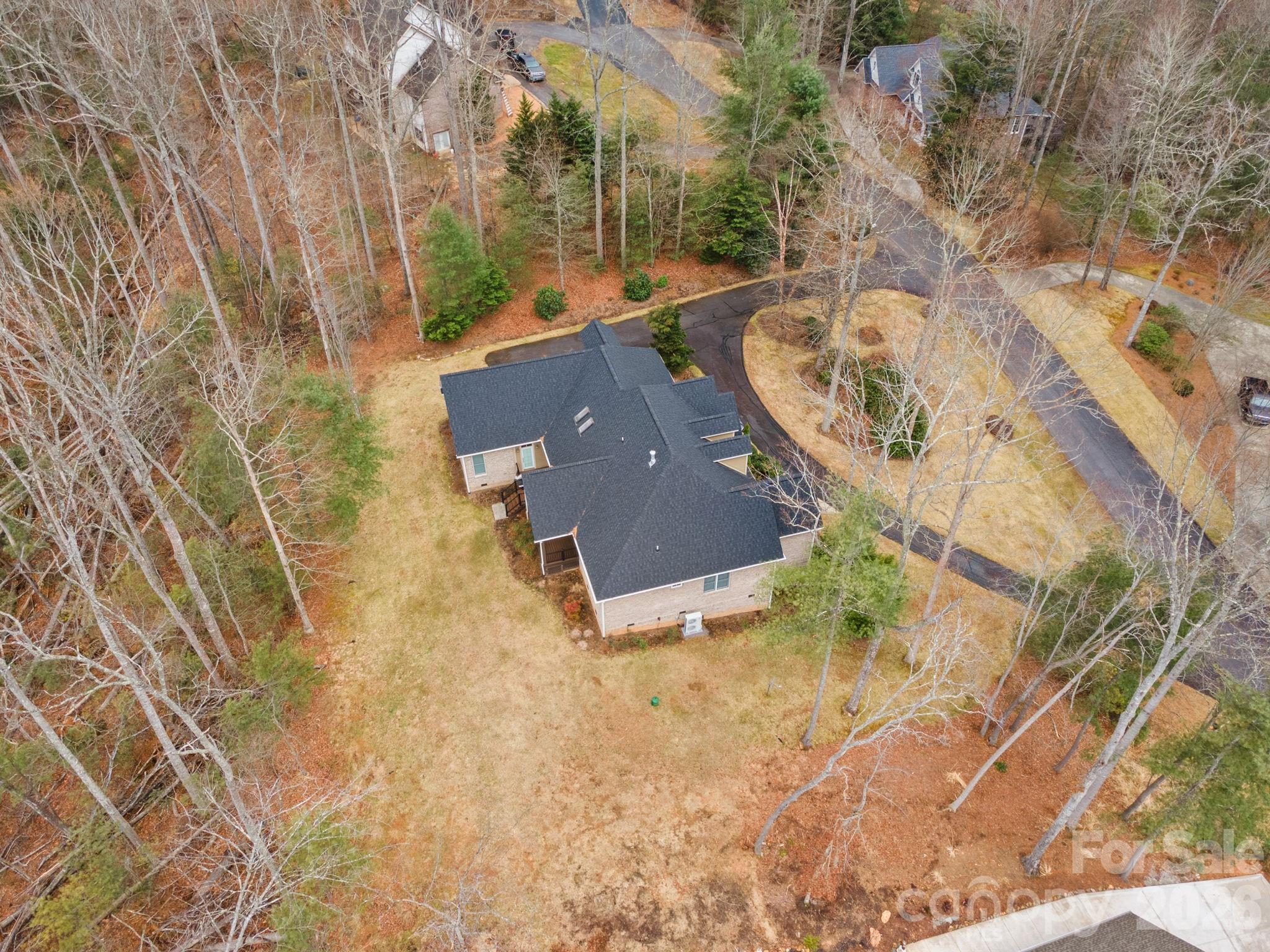 199 Judson Ridge Road Arden, NC 28704 - Photo 48 of 48 an aerial view of residential house with pool and yard