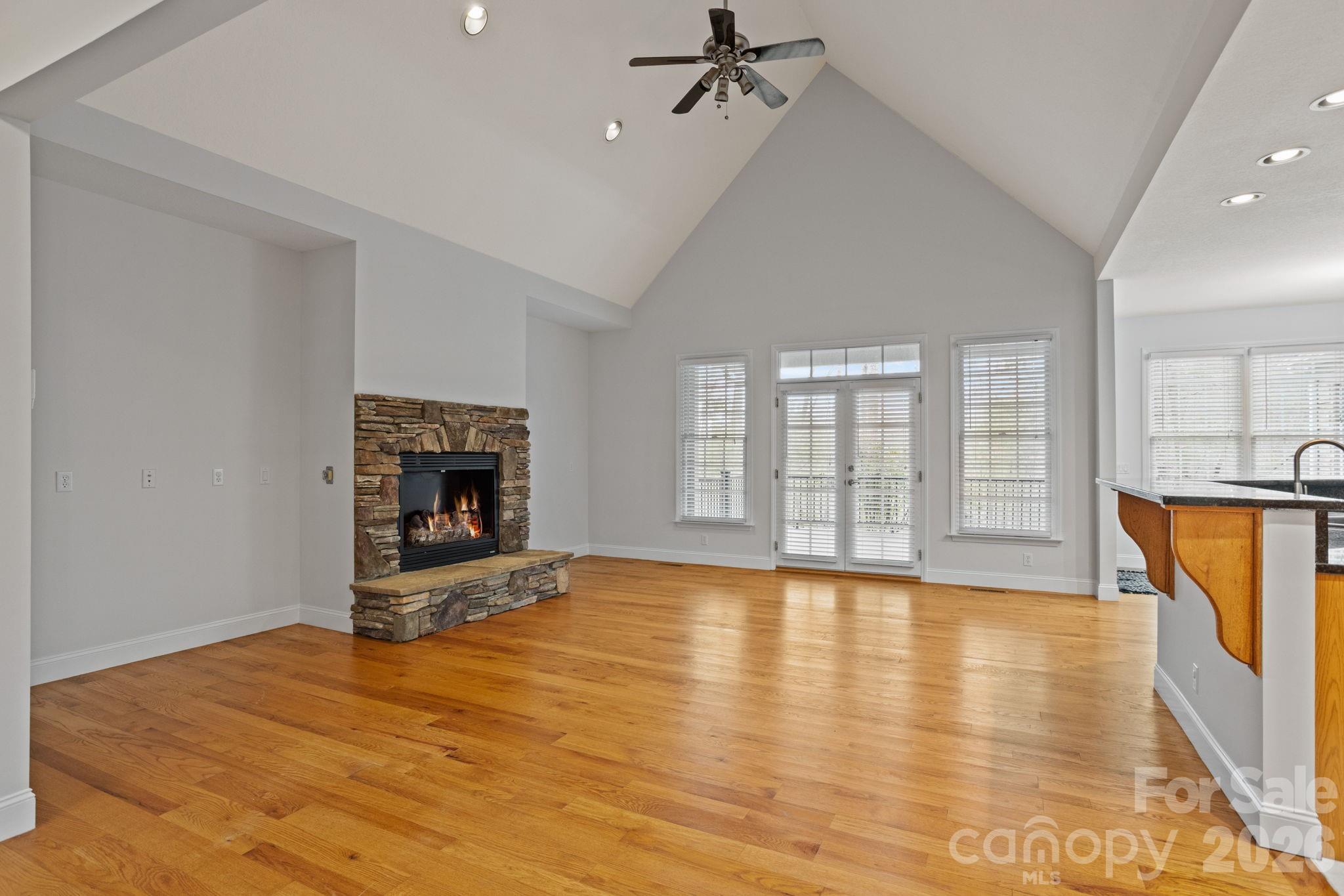 199 Judson Ridge Road Arden, NC 28704 - Photo 9 of 48 a view of empty room with fireplace and wooden floor