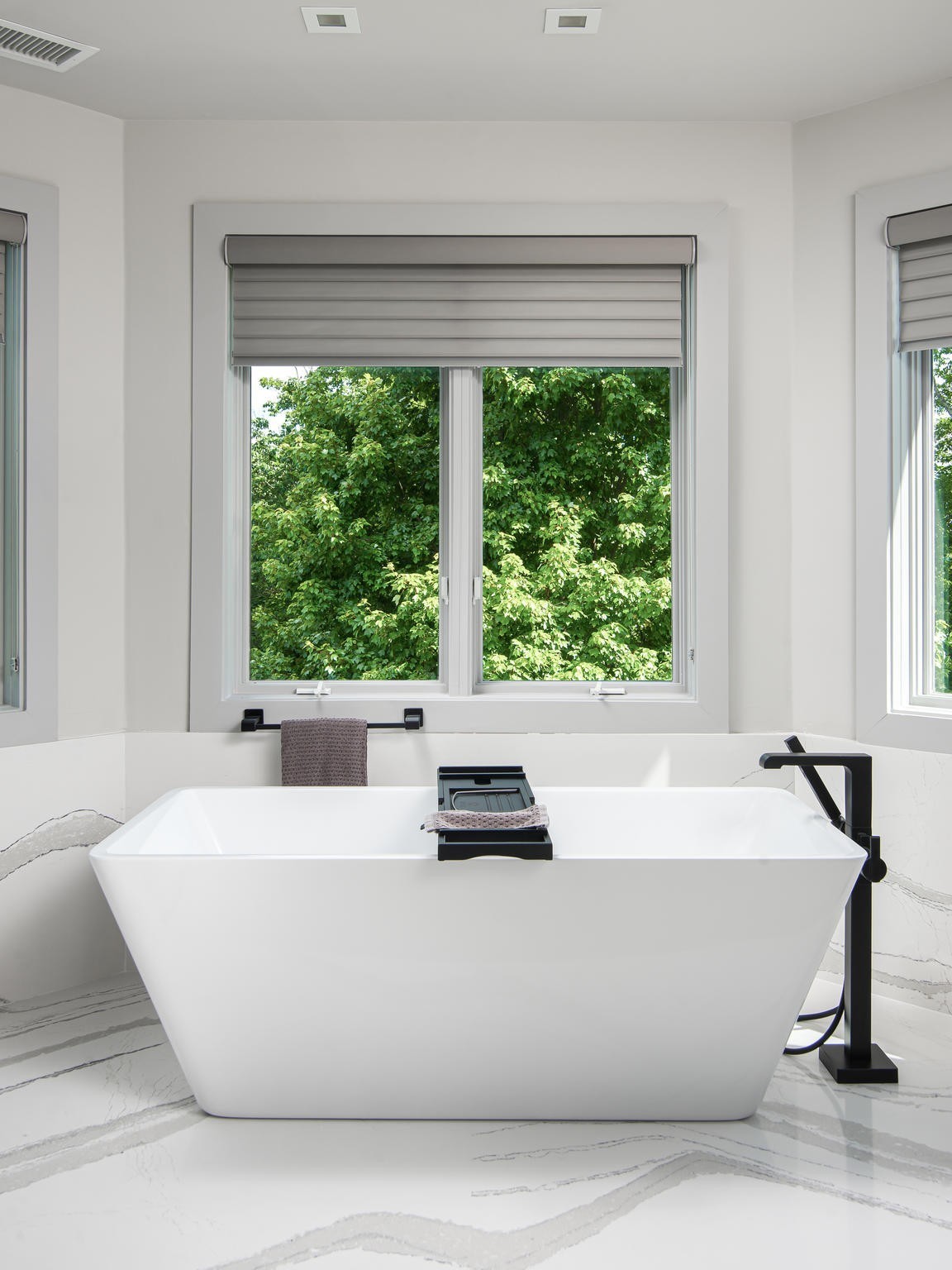 813 Deercrossing Nashville, TN 37220 - Photo 21 of 49 a white bath tub sitting in a bedroom next to a window
