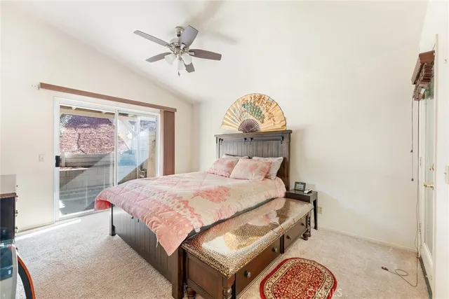 a bedroom with a bed and a table