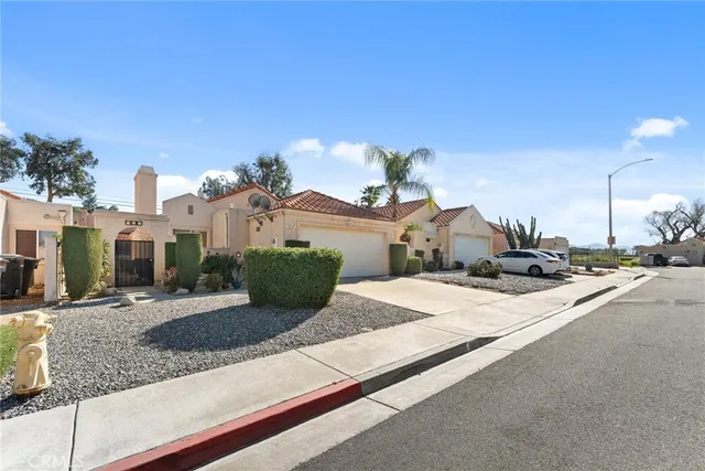 a view of houses with an outdoor space and lakeside