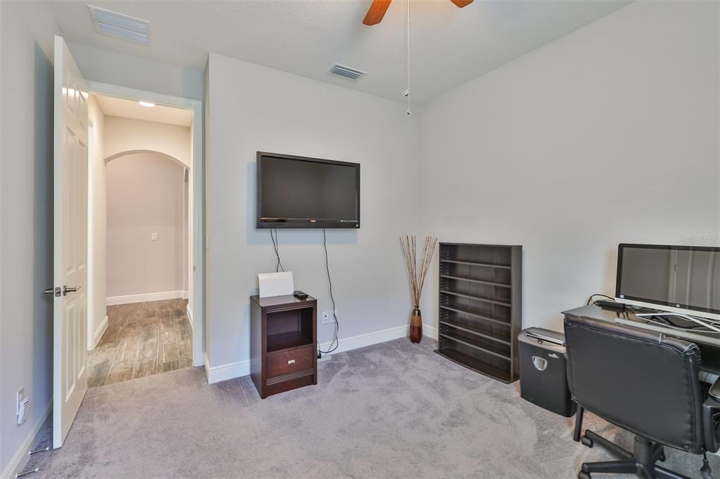 7411 Windport Lane Apollo Beach, FL 33572 - Photo 27 of 71 a view of a livingroom with furniture and a flat screen tv