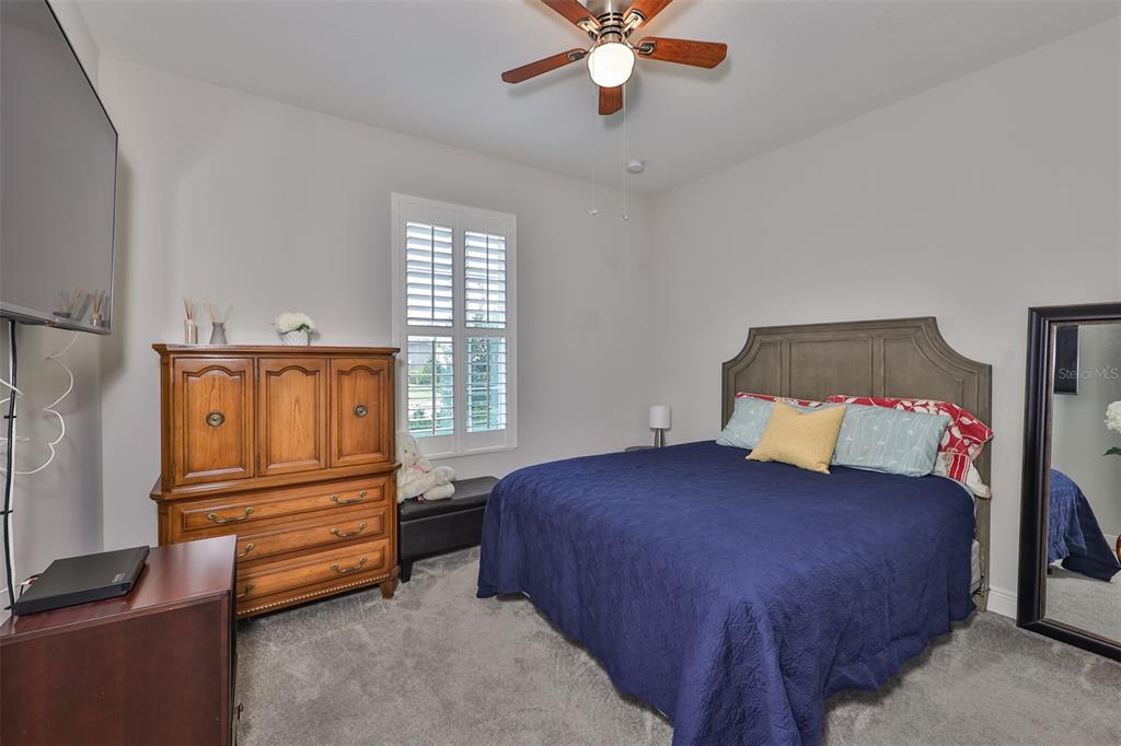7411 Windport Lane Apollo Beach, FL 33572 - Photo 29 of 71 a bedroom with a bed and window