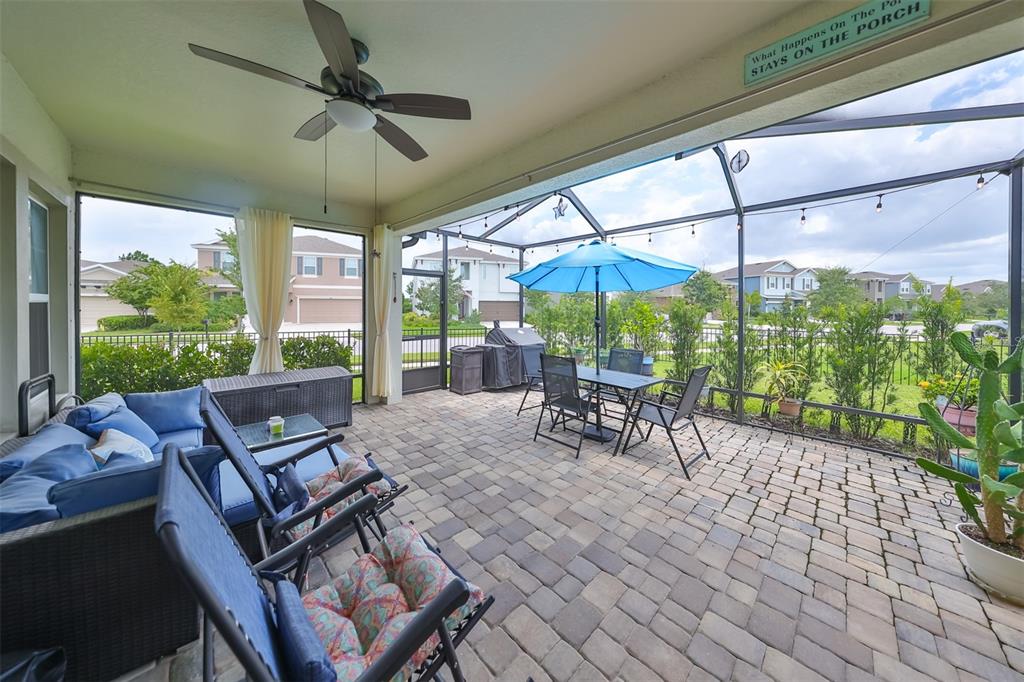 7411 Windport Lane Apollo Beach, FL 33572 - Photo 37 of 71 a view of a patio with a table chairs and a floor