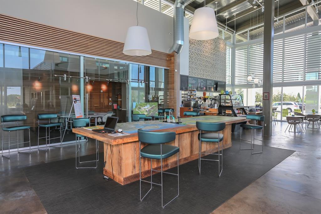 7411 Windport Lane Apollo Beach, FL 33572 - Photo 53 of 71 a dining room with furniture and wooden floor
