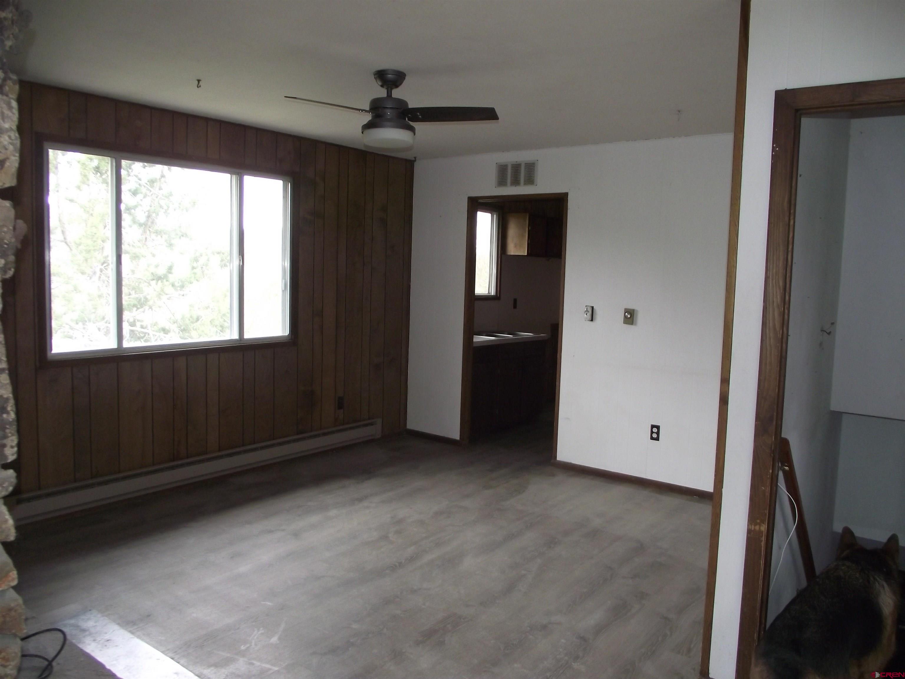 42996 Needle Rock Road Crawford, CO 81415 - Photo 19 of 45 a view of an empty room with a window