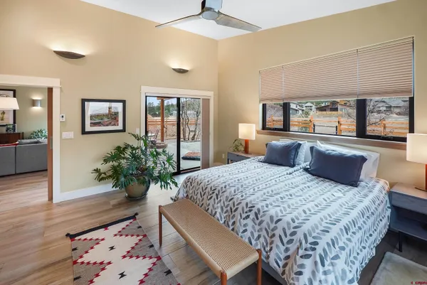 a bedroom with a large bed and a dresser