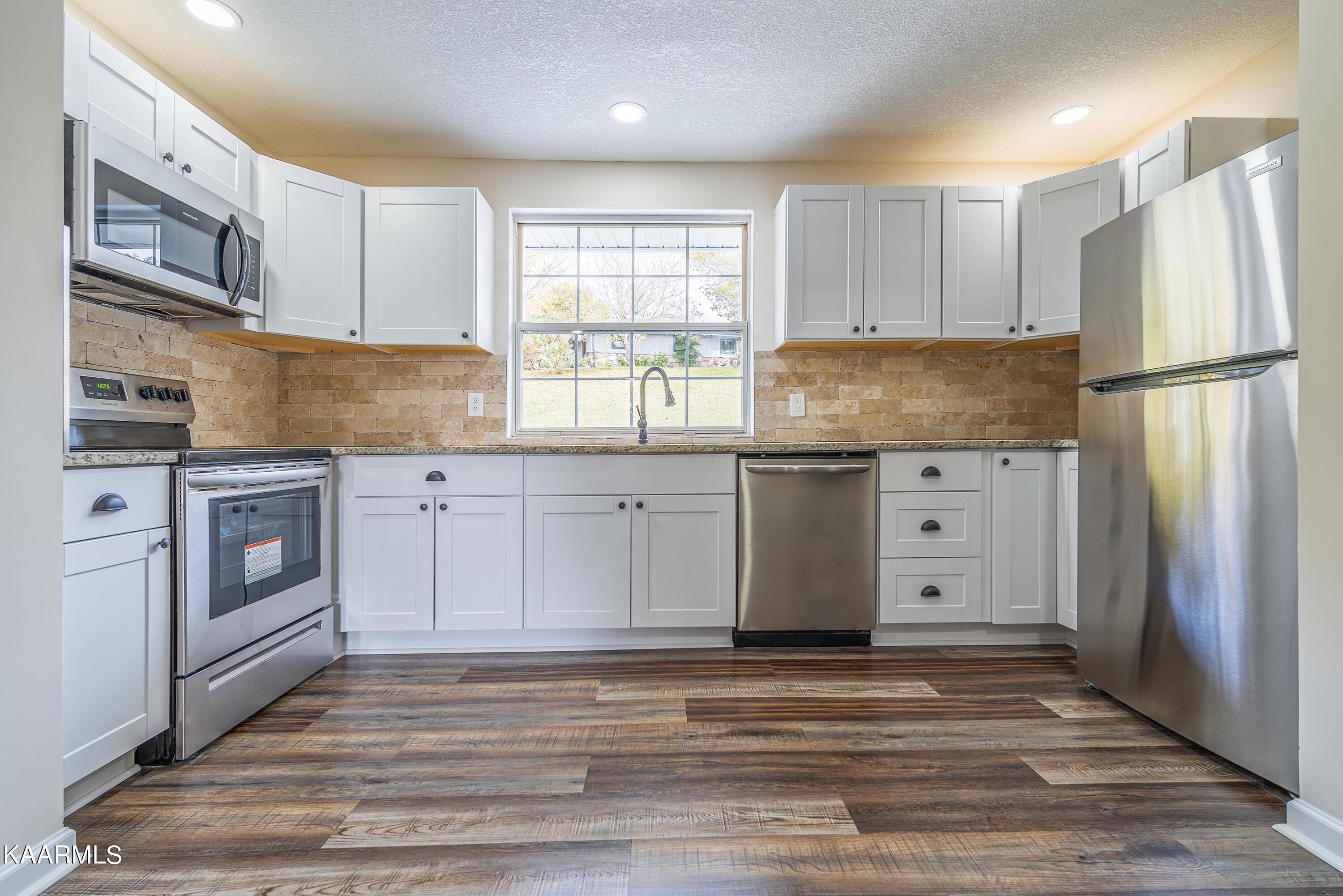 407 Zion Hill Road Sevierville, TN 37876 - Photo 8 of 24 10_Guest Kitchen