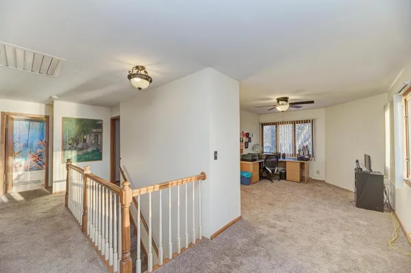 a view of a livingroom with furniture and windows