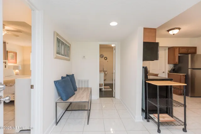 a living room with furniture a dining table and chairs