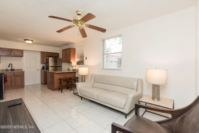 a living room with furniture and a window