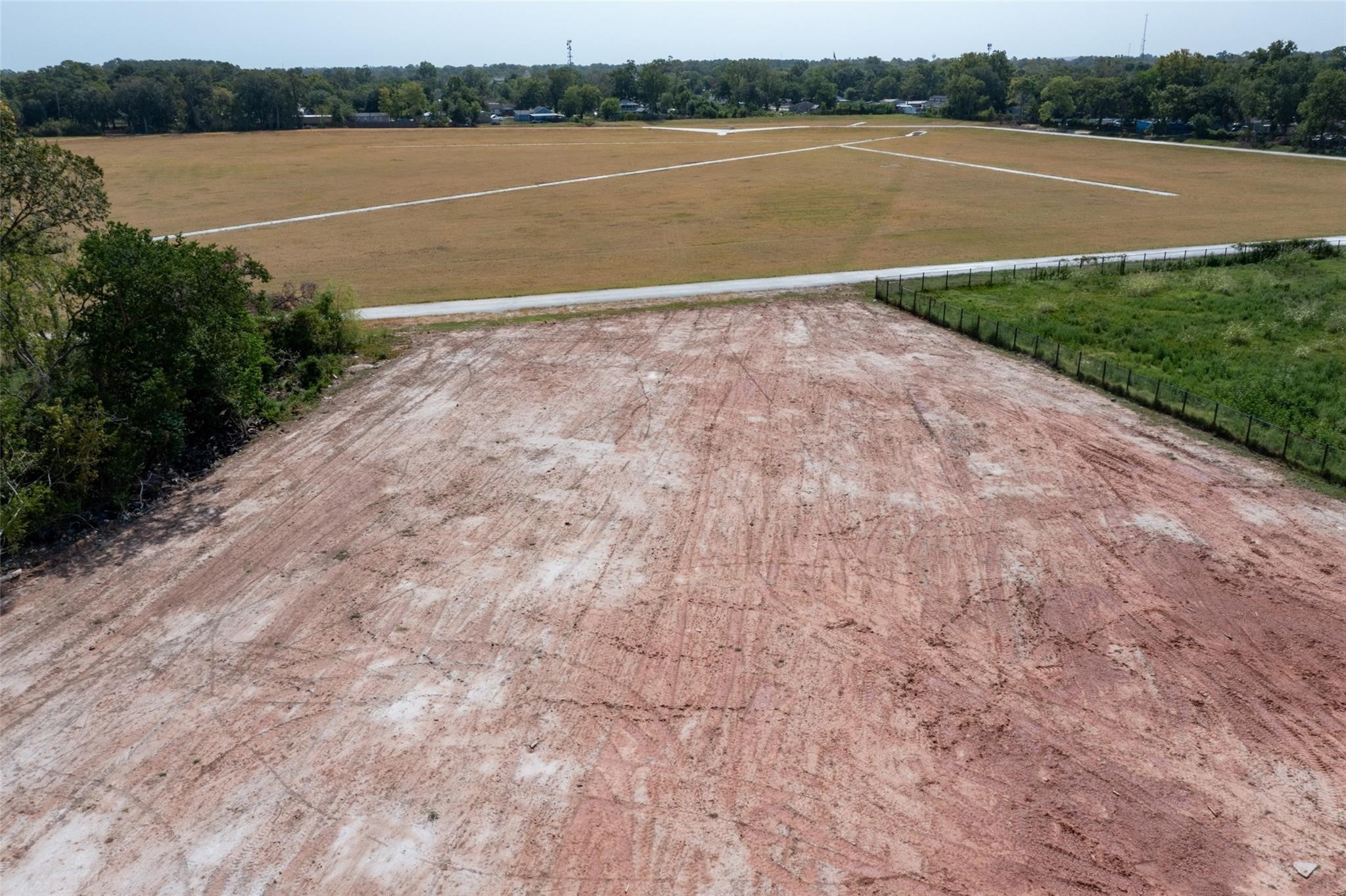 11324 Eastex Rd Freeway Houston, TX 77093 - Photo 15 of 19 a view of a lake view with a big yard and large trees