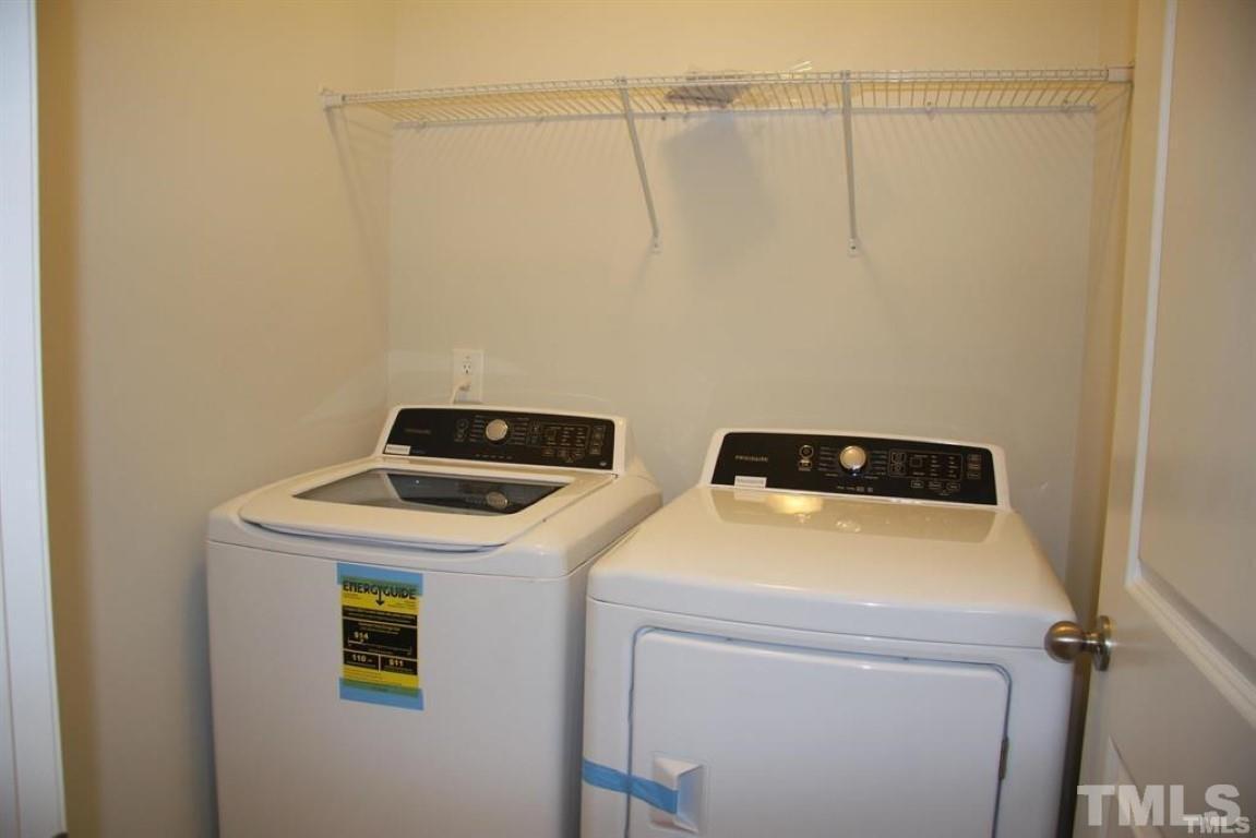 2919 Sunflower Road Apex, NC 27502 - Photo 29 of 34 a utility room with dryer and washer