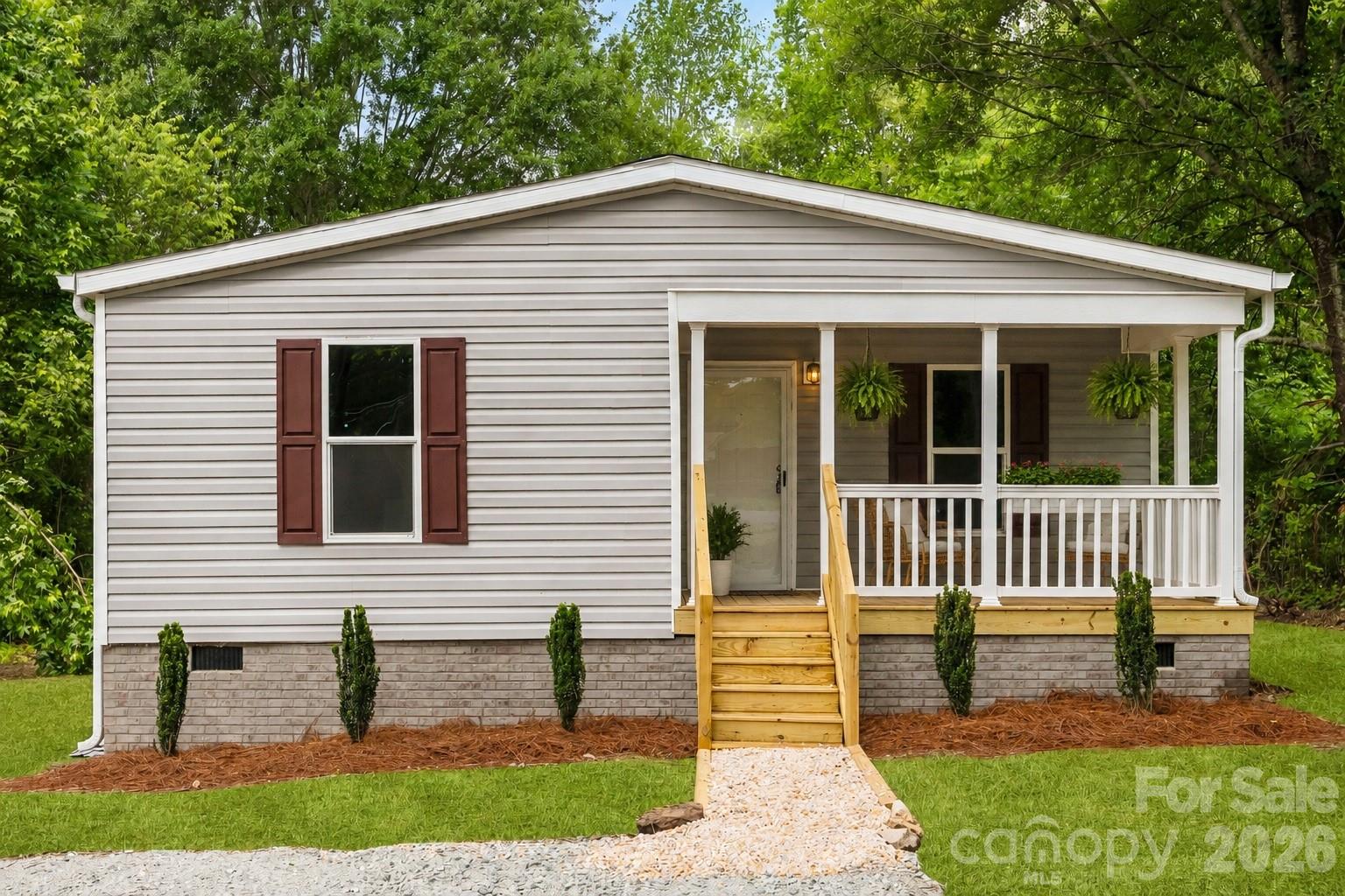 321 Bell Road Kings Mountain, NC 28086 - Photo 2 of 32 a front view of a house with a yard