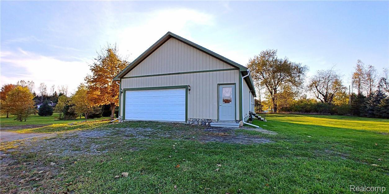 886 Chase Lake Road Howell, MI 48855 - Photo 50 of 52 Two Car Side Entry Attached Garage with Service Door.jpg