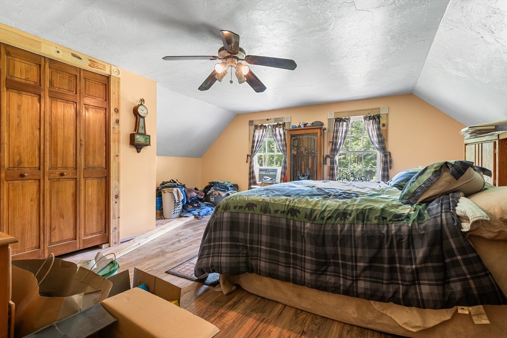 87 W Road Canterbury, NH 03224 - Photo 9 of 21 a bedroom with a bed and wooden floor