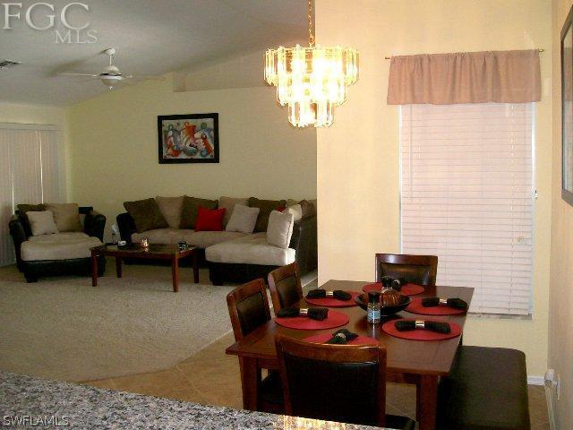 17568 Homewood Road Fort Myers, FL 33967 - Photo 6 of 18 a living room with furniture and a table