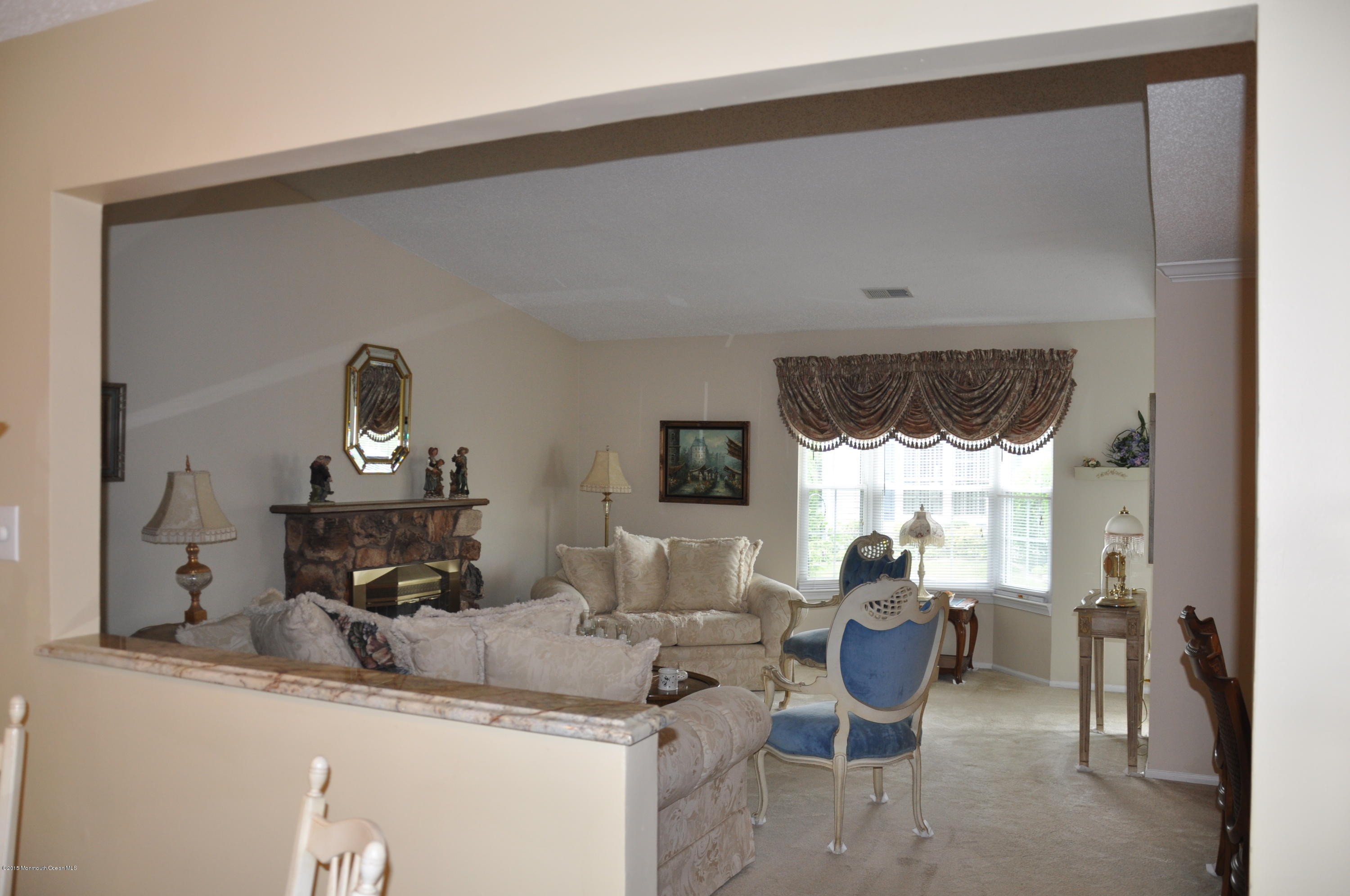 6 Ivy Ridge Close, Unit 1000 Freehold, NJ 07728 - Photo 16 of 18 living room from kitchen