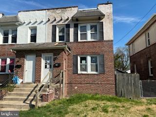 273 Broad Street Carneys Point, NJ 08069 - Photo 1 of 14 a front view of a house with a yard