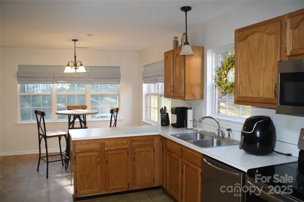 a kitchen with sink and cabinets