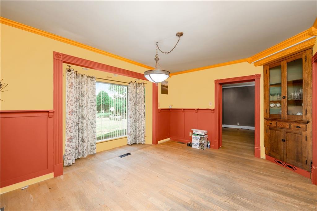 438 Main Street Prospect, PA 16052 - Photo 8 of 46 a view of empty room with wooden floor and fan
